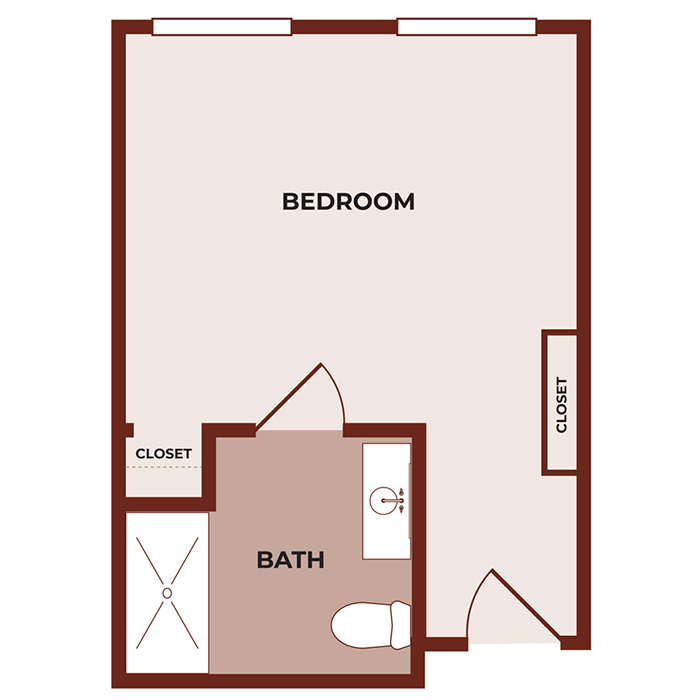 Floor plan of a room with a large bedroom, two closets, and a bathroom that includes a shower, toilet, and sink. The bathroom is accessed from the bedroom.